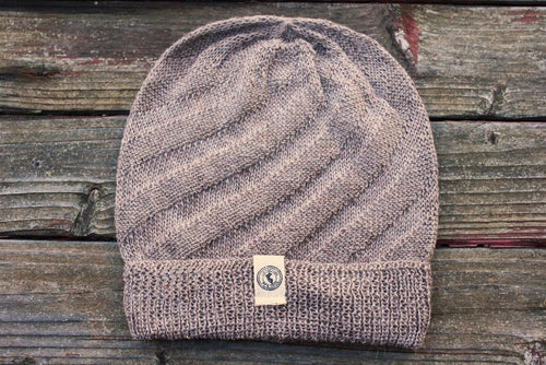 Kingsley Alpaca Hat made from 100% baby alpaca wool, hand-knit by Quechua artisans in Peru, featuring a stylish design for warmth and comfort.