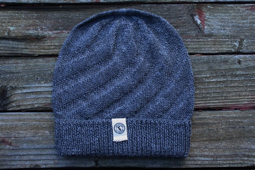 Kingsley Alpaca Hat made from 100% baby alpaca wool, hand-knit by Quechua artisans in Peru, featuring a stylish design for warmth and comfort.