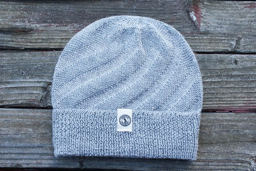 Kingsley Alpaca Hat made from 100% baby alpaca wool, hand-knit by Quechua artisans in Peru, featuring a stylish design for warmth and comfort.