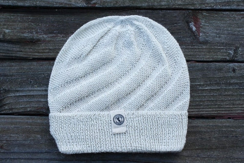 Kingsley Alpaca Hat made from 100% baby alpaca wool, hand-knit by Quechua artisans in Peru, featuring a stylish design for warmth and comfort.