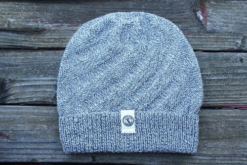 Kingsley Alpaca Hat made from 100% baby alpaca wool, hand-knit by Quechua artisans in Peru, featuring a stylish design for warmth and comfort.