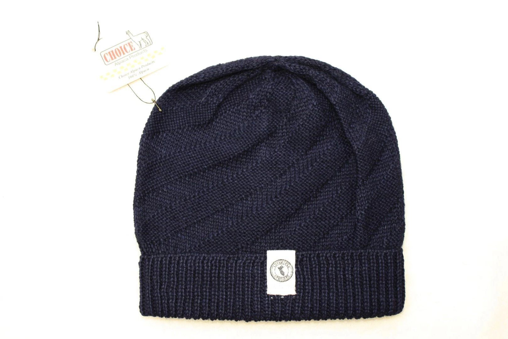 Kingsley Alpaca Hat made from 100% baby alpaca wool, hand-knit by Quechua artisans in Peru, featuring a stylish design for warmth and comfort.