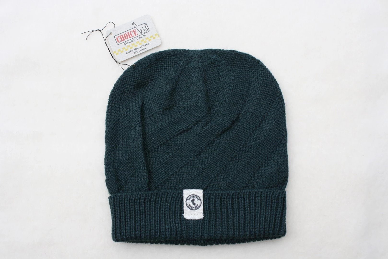 Kingsley Alpaca Hat made from 100% baby alpaca wool, hand-knit by Quechua artisans in Peru, featuring a stylish design for warmth and comfort.