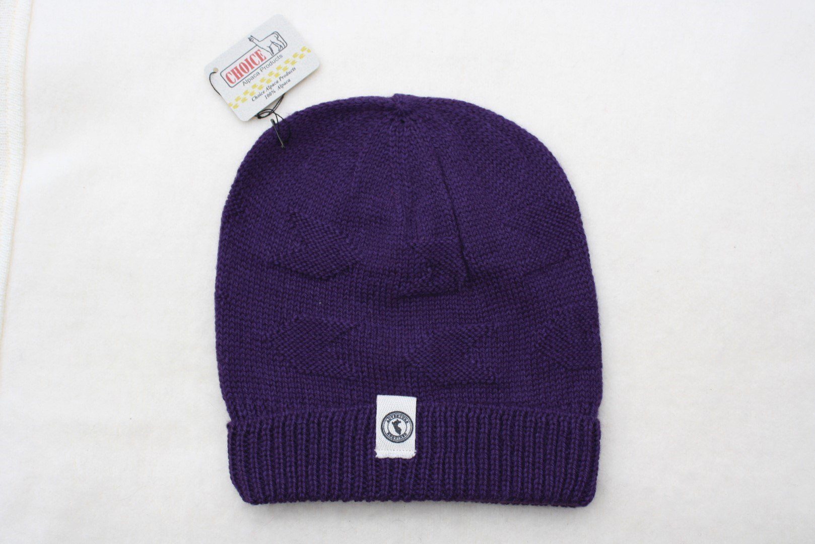 Adventure Required Messner Alpaca Hat, hand-knit from 100% baby alpaca wool, showcasing a stylish design inspired by great explorers.