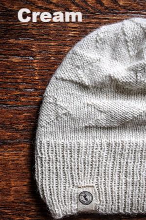 Adventure Required Messner Alpaca Hat, hand-knit from 100% baby alpaca wool, showcasing a stylish design inspired by great explorers.