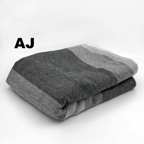 Luxurious Alpaca at Home Alpaca Throw featuring a brushed striped design, perfect for cozying up at home or on the go.