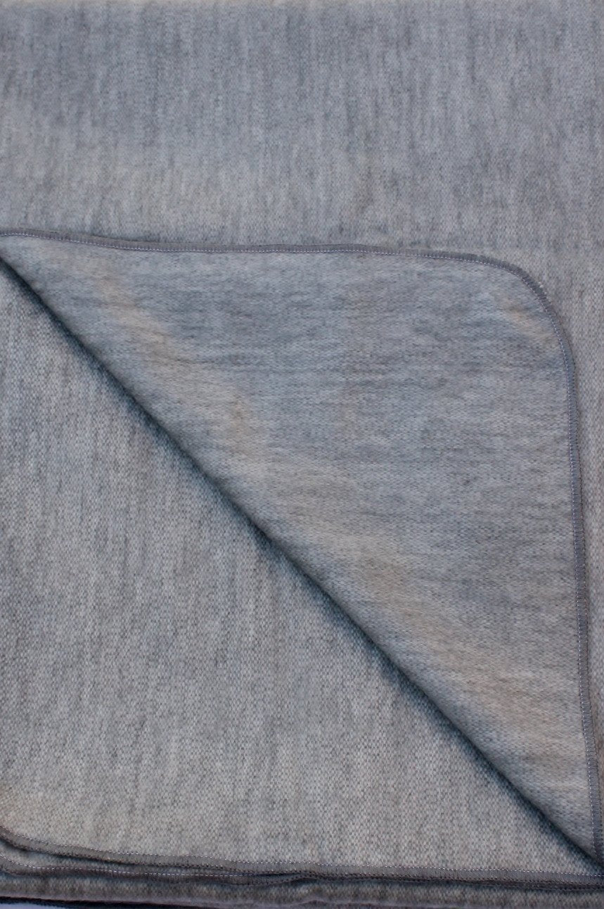 Luxurious Alpaca at Home Alpaca Throw featuring a brushed striped design, perfect for cozying up at home or on the go.