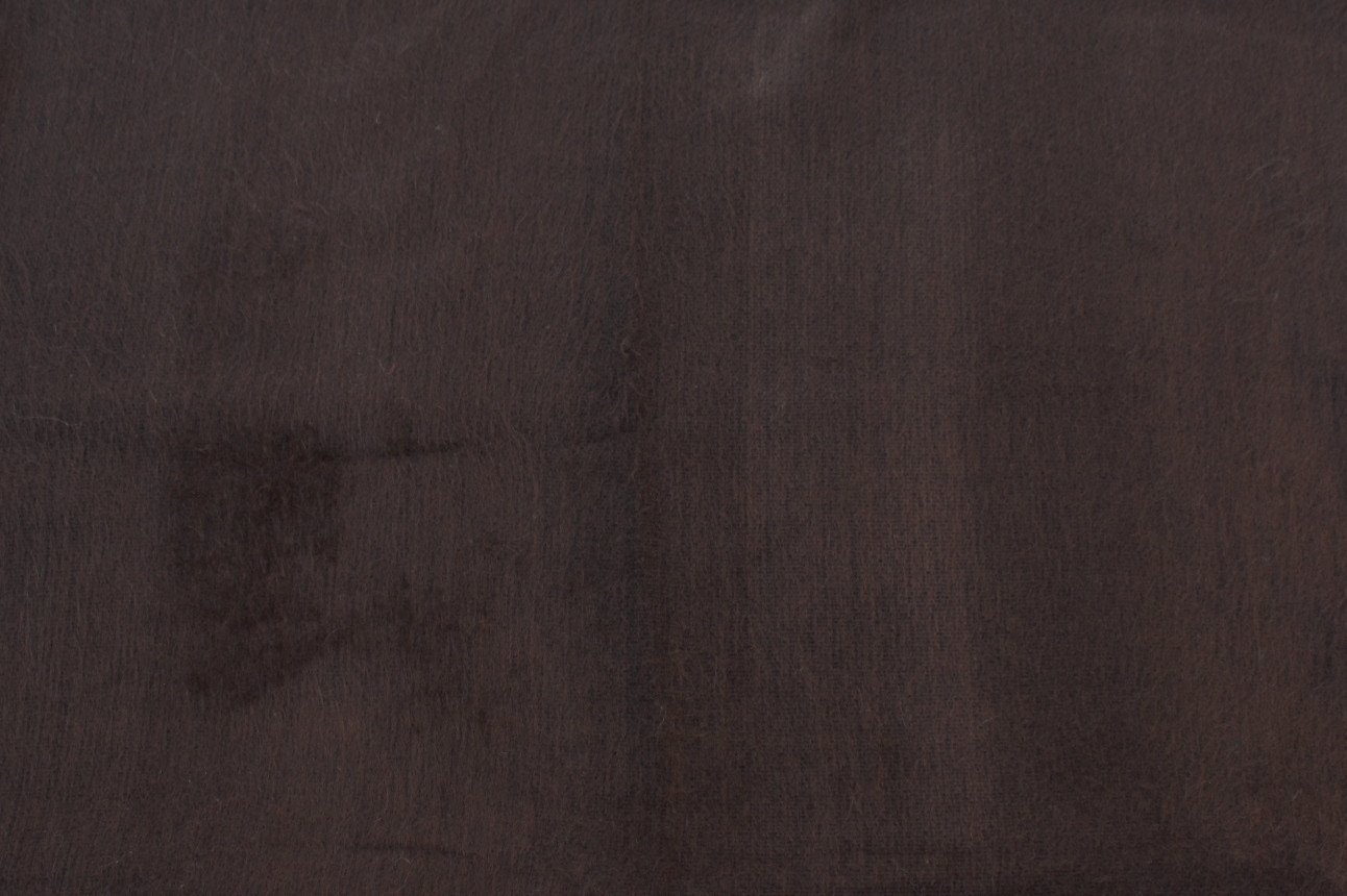 Luxurious alpaca bed blanket in various colors, showcasing its soft texture and oversized design, perfect for cozy nights.