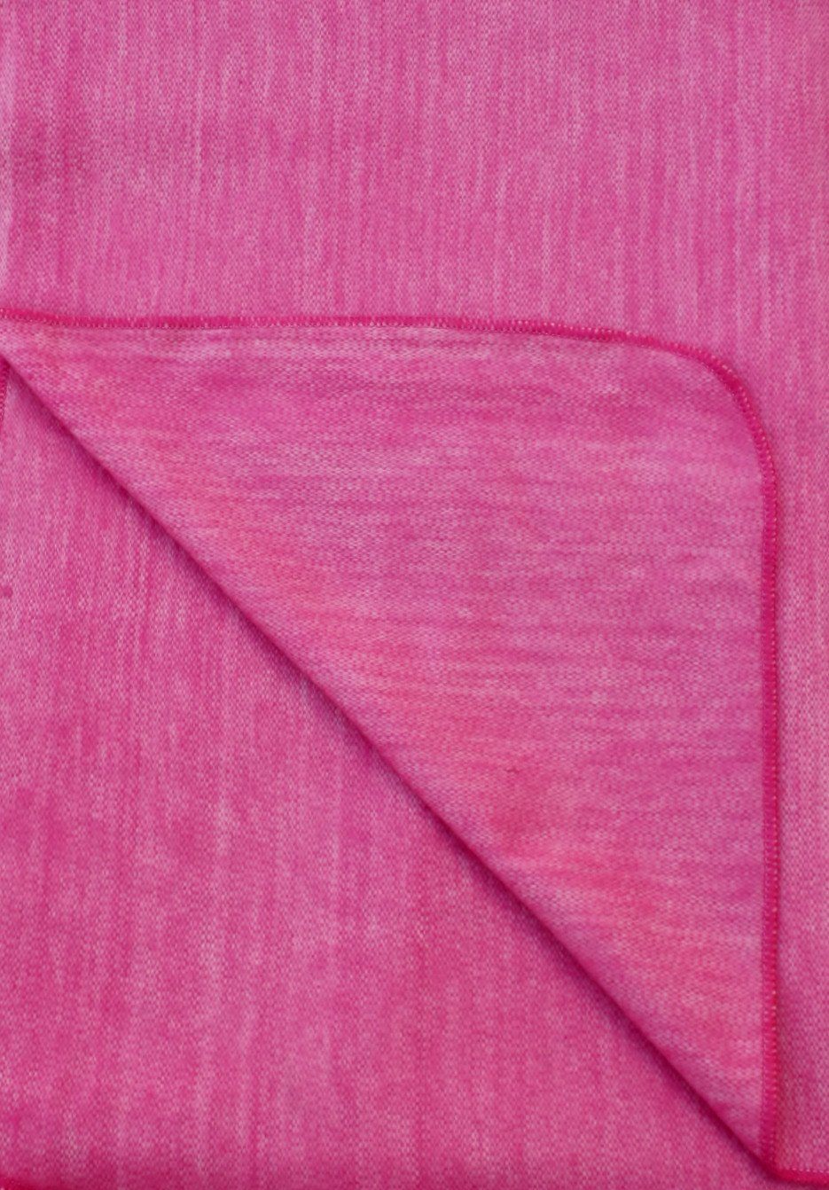 Luxurious alpaca bed blanket in various colors, showcasing its soft texture and oversized design, perfect for cozy nights.