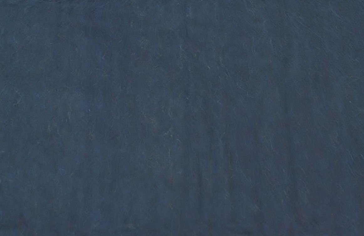 Luxurious alpaca bed blanket in various colors, showcasing its soft texture and oversized design, perfect for cozy nights.