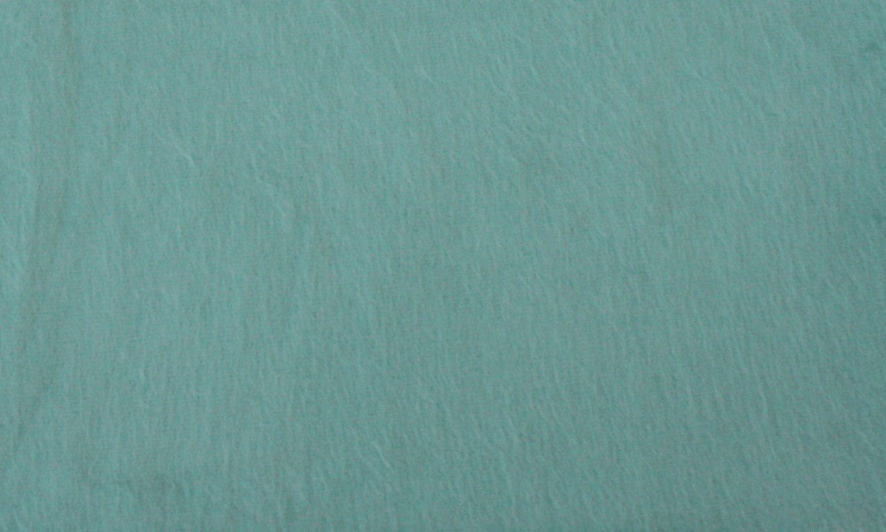 Luxurious alpaca bed blanket in various colors, showcasing its soft texture and oversized design, perfect for cozy nights.