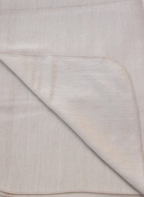 Luxurious alpaca bed blanket in various colors, showcasing its soft texture and oversized design, perfect for cozy nights.