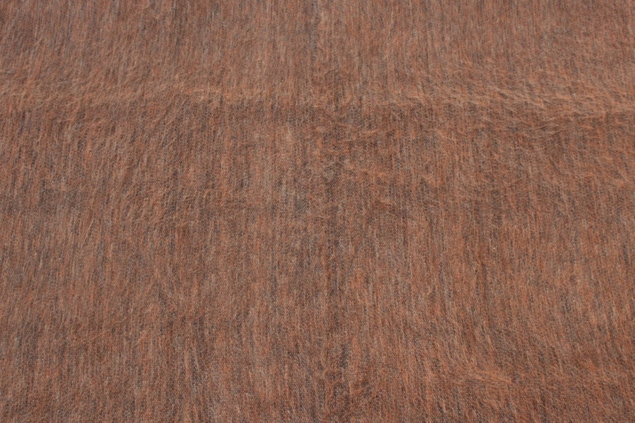 Luxurious alpaca bed blanket in various colors, showcasing its soft texture and oversized design, perfect for cozy nights.