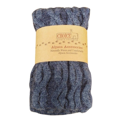 A pair of stylish thick cabled alpaca leg warmers in a cozy setting, showcasing their soft texture and fashionable design.