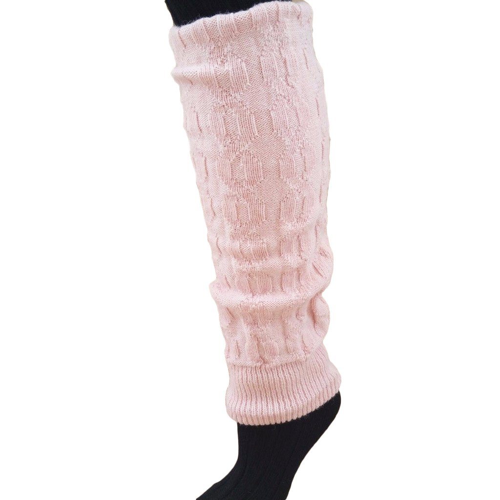 A pair of stylish thick cabled alpaca leg warmers in a cozy setting, showcasing their soft texture and fashionable design.