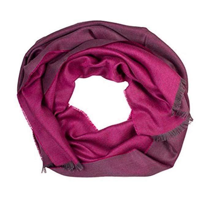 A luxurious fuchsia shawl made from a blend of alpaca wool and silk, showcasing its soft texture and vibrant color.