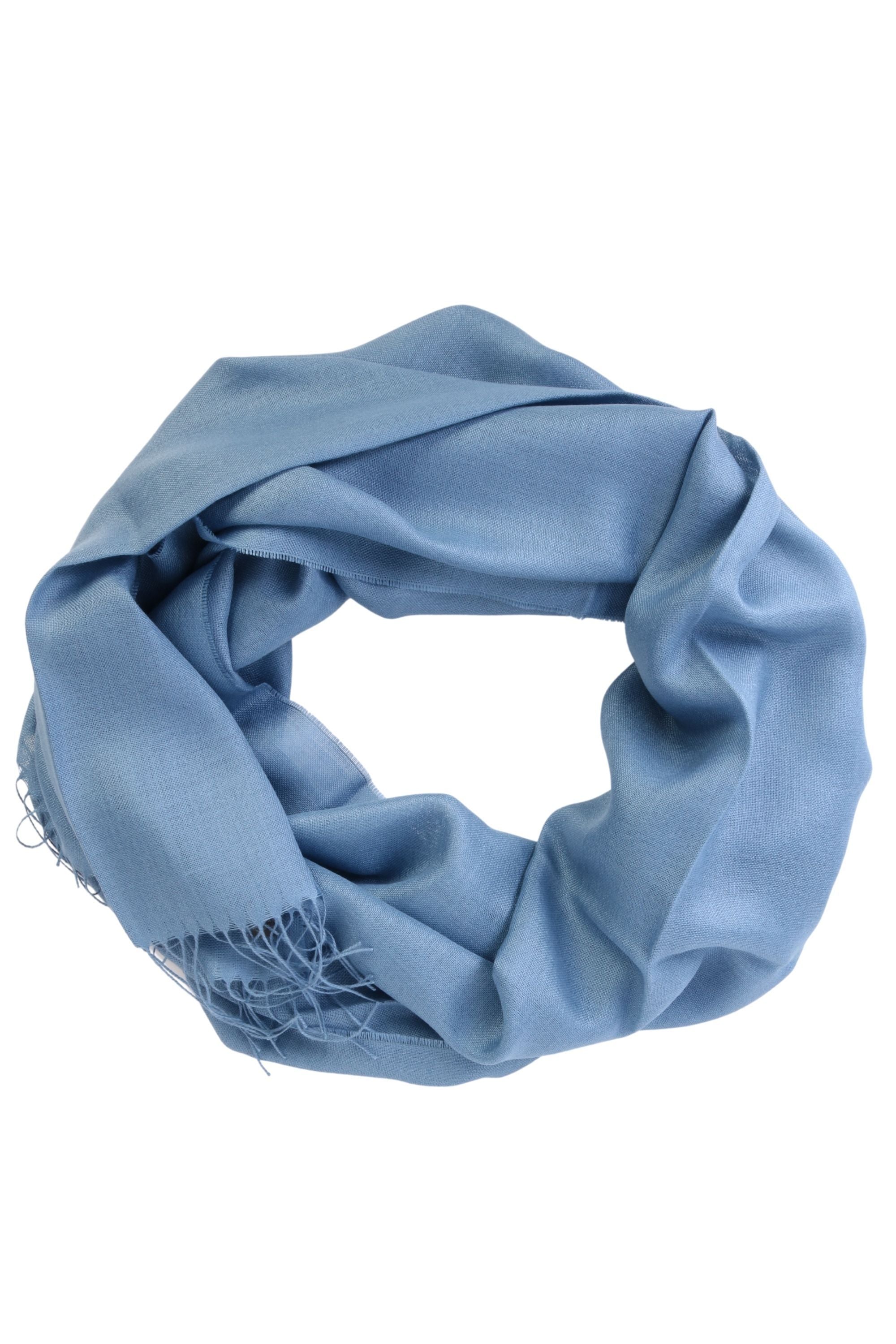 Luxurious sea blue shawl made of 70% baby alpaca wool and 30% silk, showcasing its soft texture and elegant design.