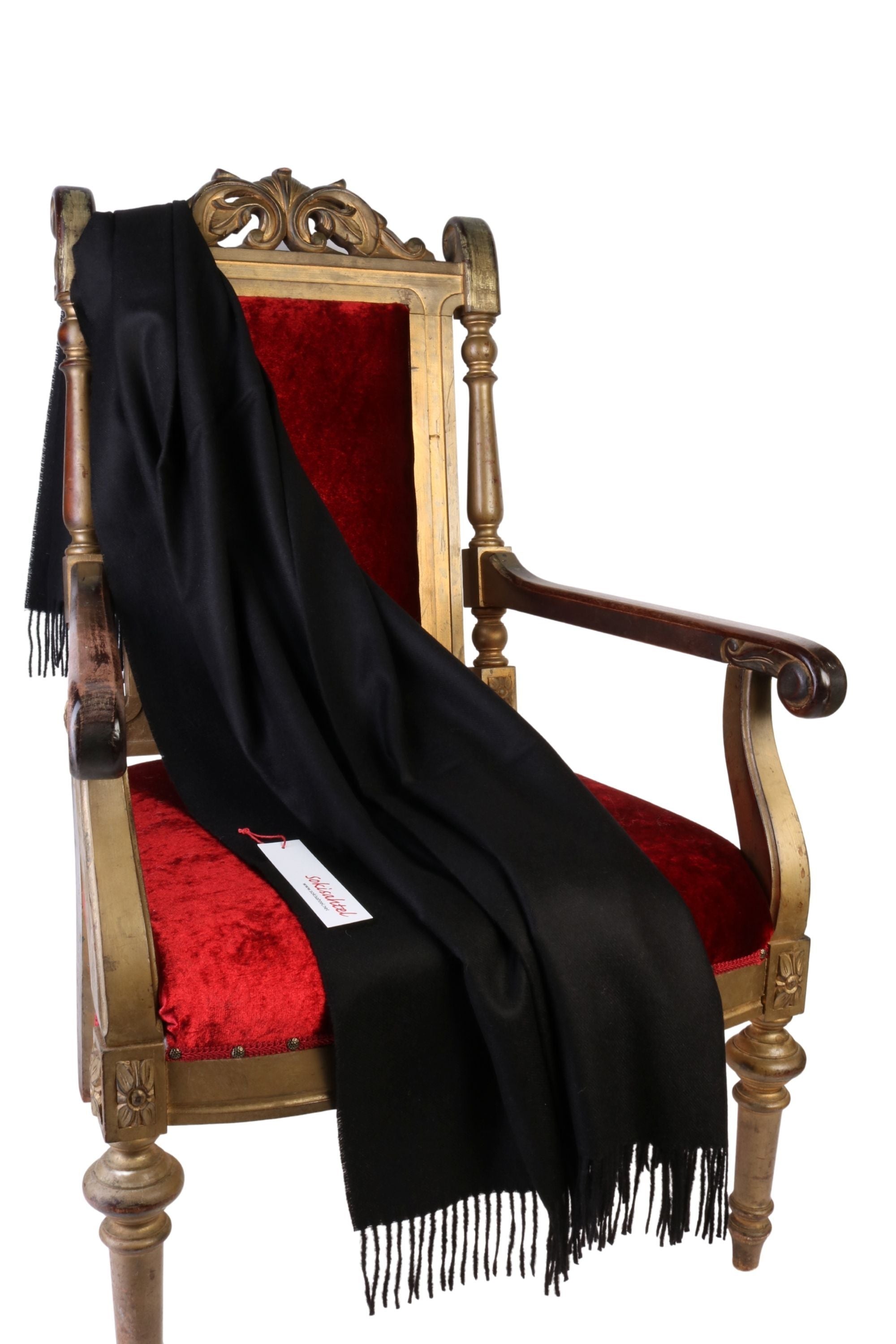 Luxurious black plaid made from 100% alpaca wool, showcasing its soft texture and elegant design.