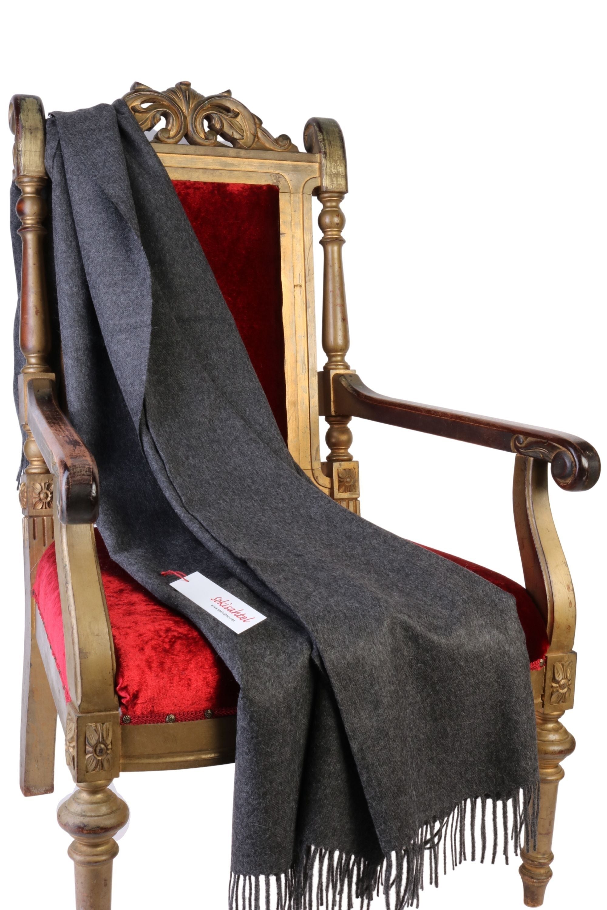 Luxurious dark gray plaid made from 100% alpaca wool, showcasing its soft texture and elegant design.