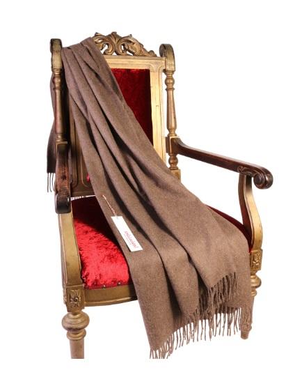 Luxurious light brown plaid made from 100% alpaca wool, showcasing its soft texture and elegant design.