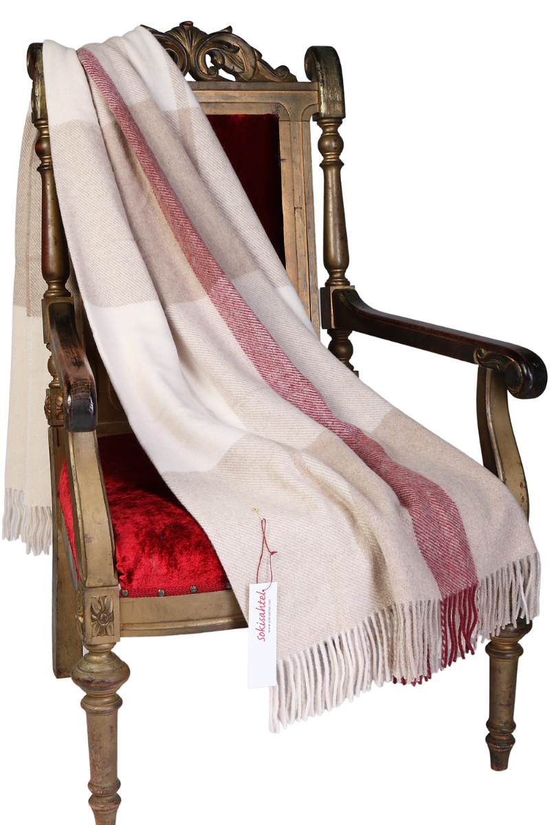 Luxurious pink beige checkered plaid made from 100% alpaca wool, showcasing its soft texture and elegant design.