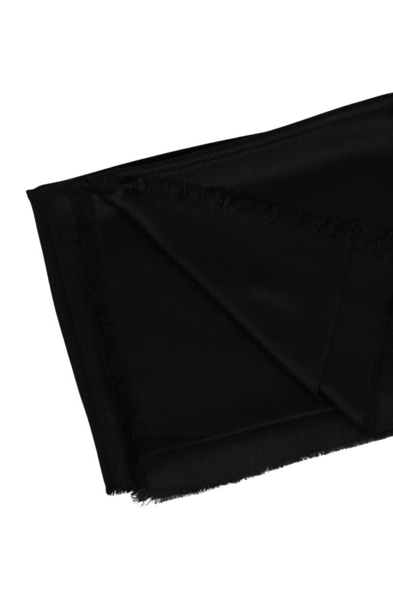 A luxurious black shoulder scarf made from 70% Royal alpaca wool and 30% silk, elegantly draped to showcase its softness and warmth.