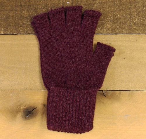 A pair of stylish fingerless alpaca gloves in natural colors, showcasing their soft texture and warm design, perfect for texting and outdoor activities.