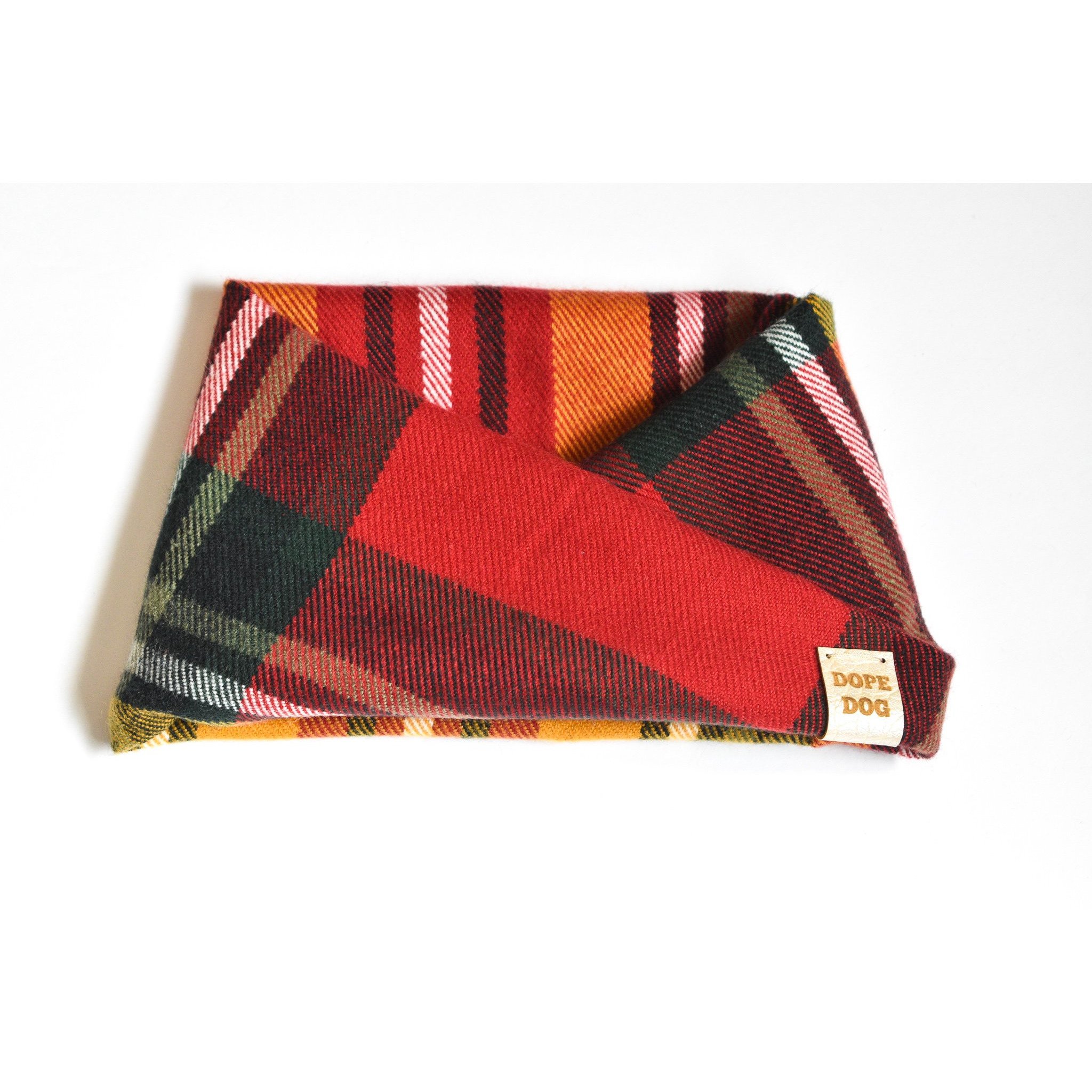 A cozy Apple Spice Dog Scarf featuring a stylish twist design, perfect for dogs of all sizes, made from soft cotton fabric.