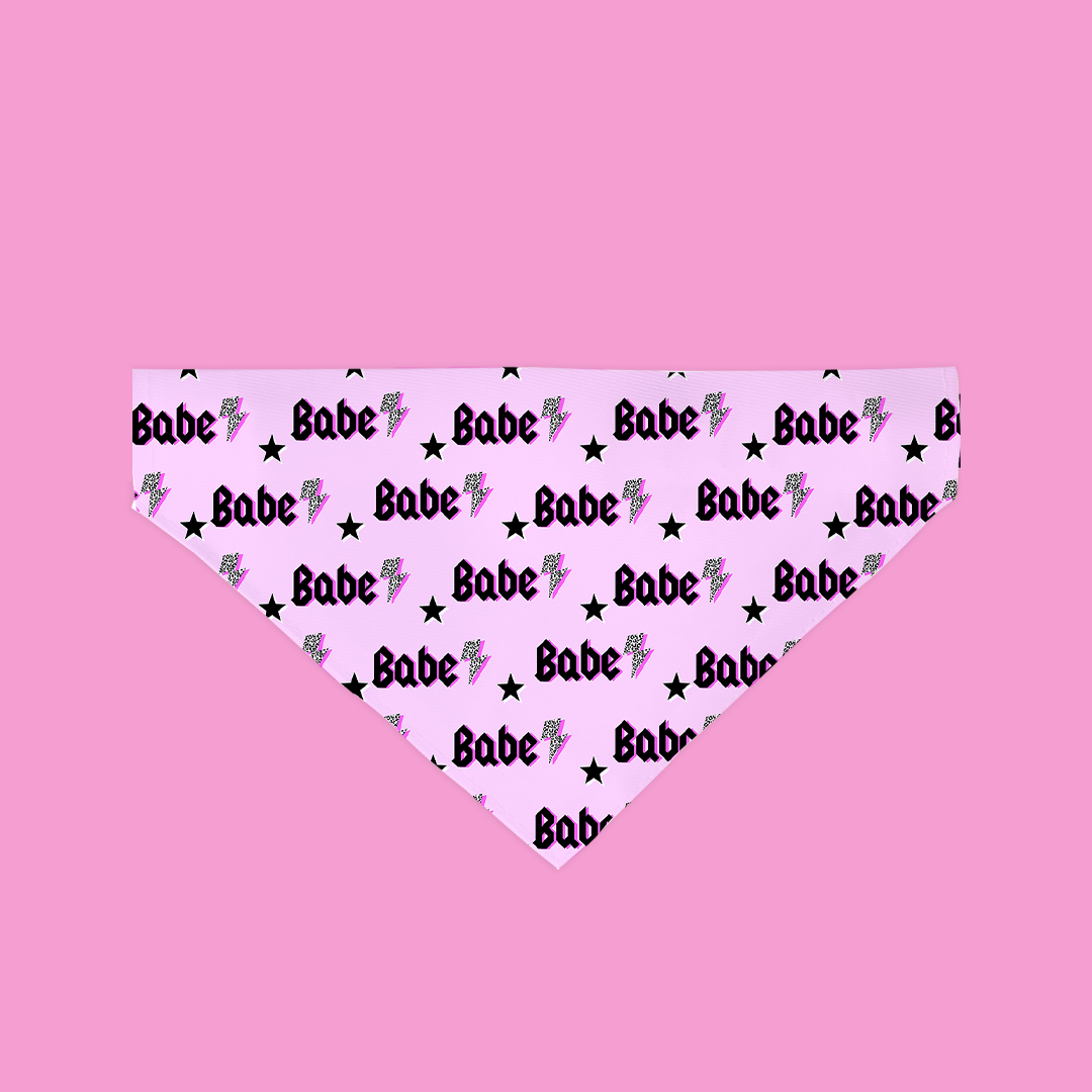 A colorful and stylish Babe Bandana designed for dogs, featuring soft polyester fabric and a unique handmade design.