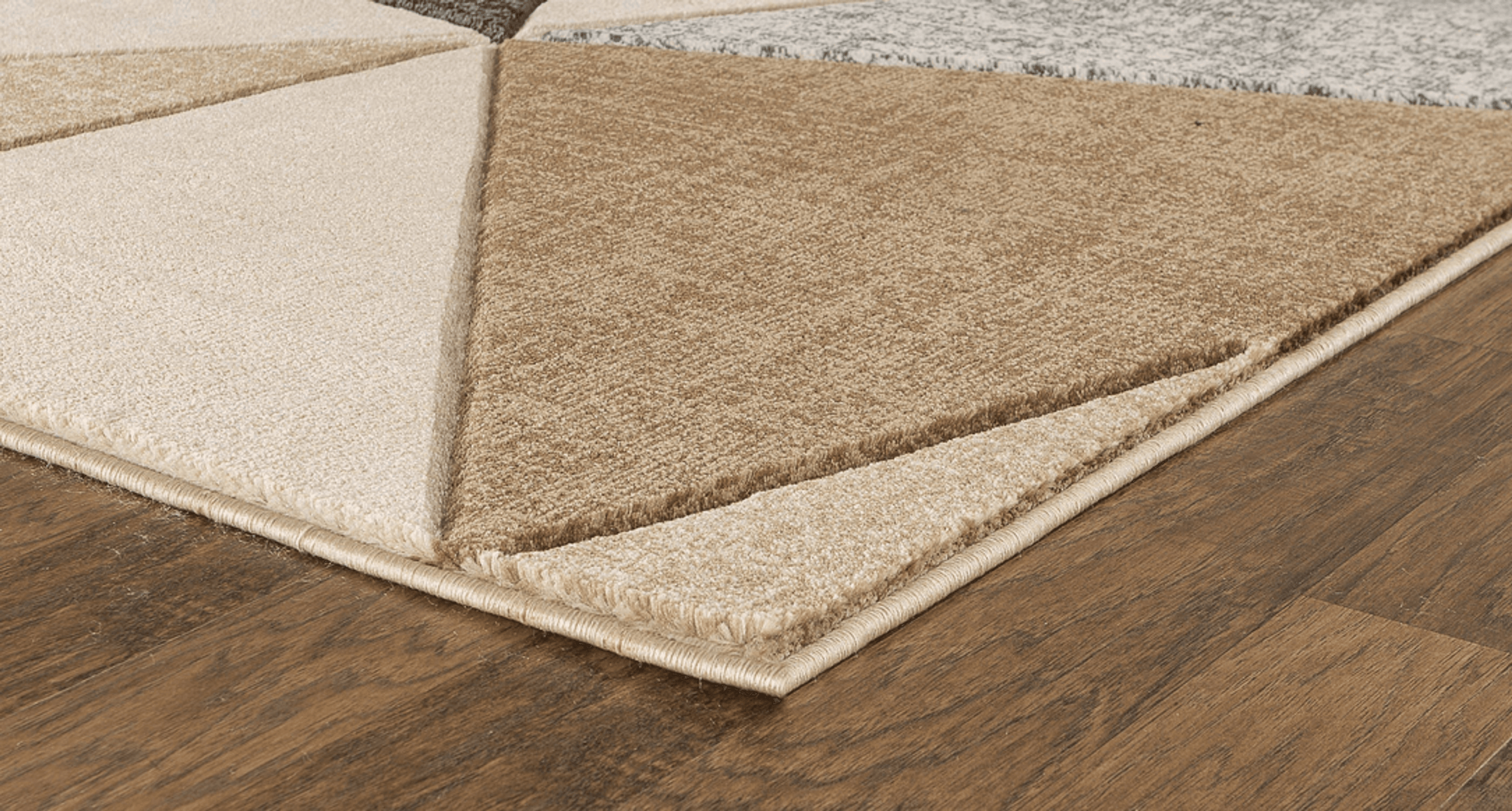 Beige geometric hand-carved soft rug measuring 3'8" x 5'6", showcasing a modern design and plush texture.
