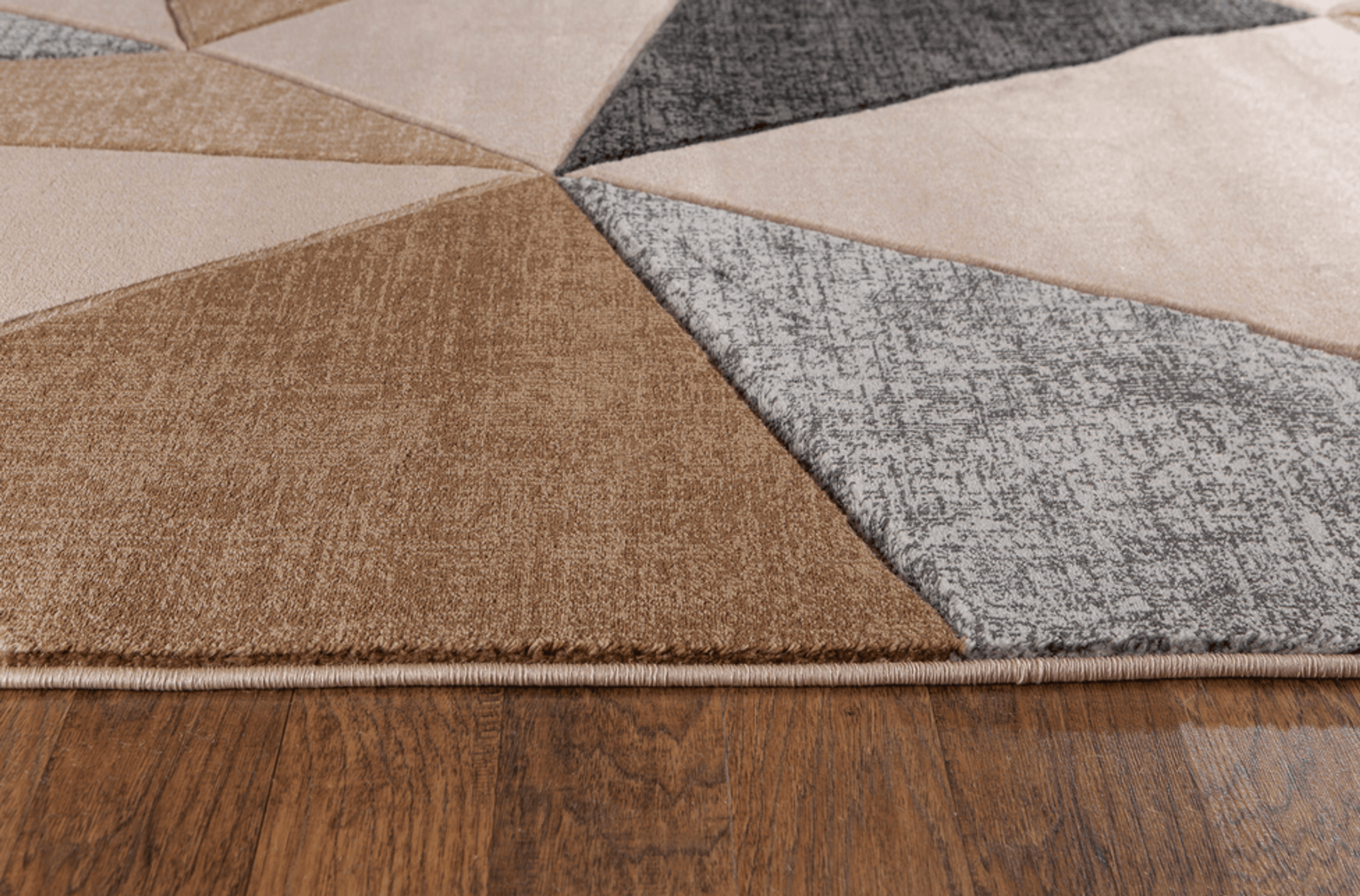 Beige geometric hand-carved soft rug measuring 3'8" x 5'6", showcasing a modern design and plush texture.