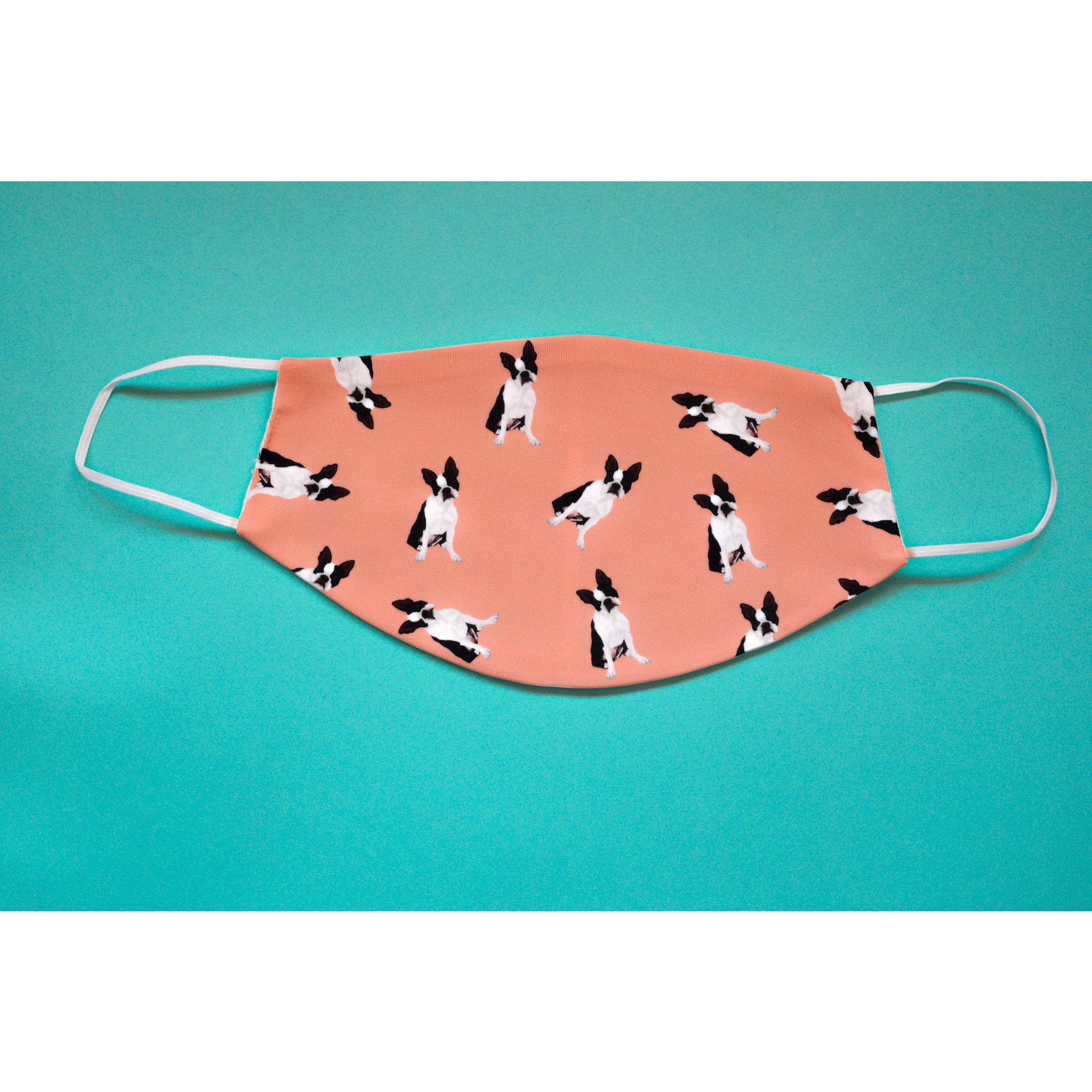 A handmade Boston Terrier face cover featuring a cute design, made from breathable polyester and organic cotton, perfect for everyday use.