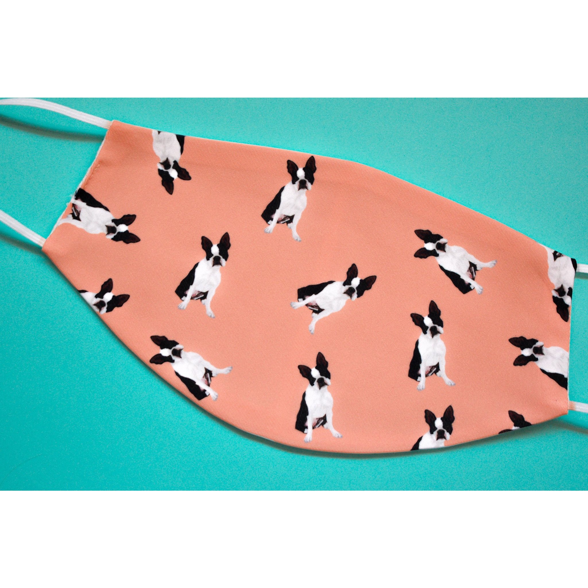 A handmade Boston Terrier face cover featuring a cute design, made from breathable polyester and organic cotton, perfect for everyday use.