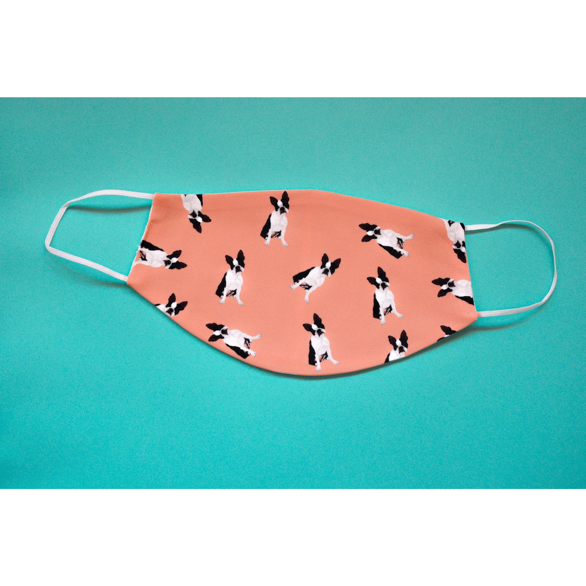 A handmade Boston Terrier face cover featuring a cute design, made from breathable polyester and organic cotton, perfect for everyday use.