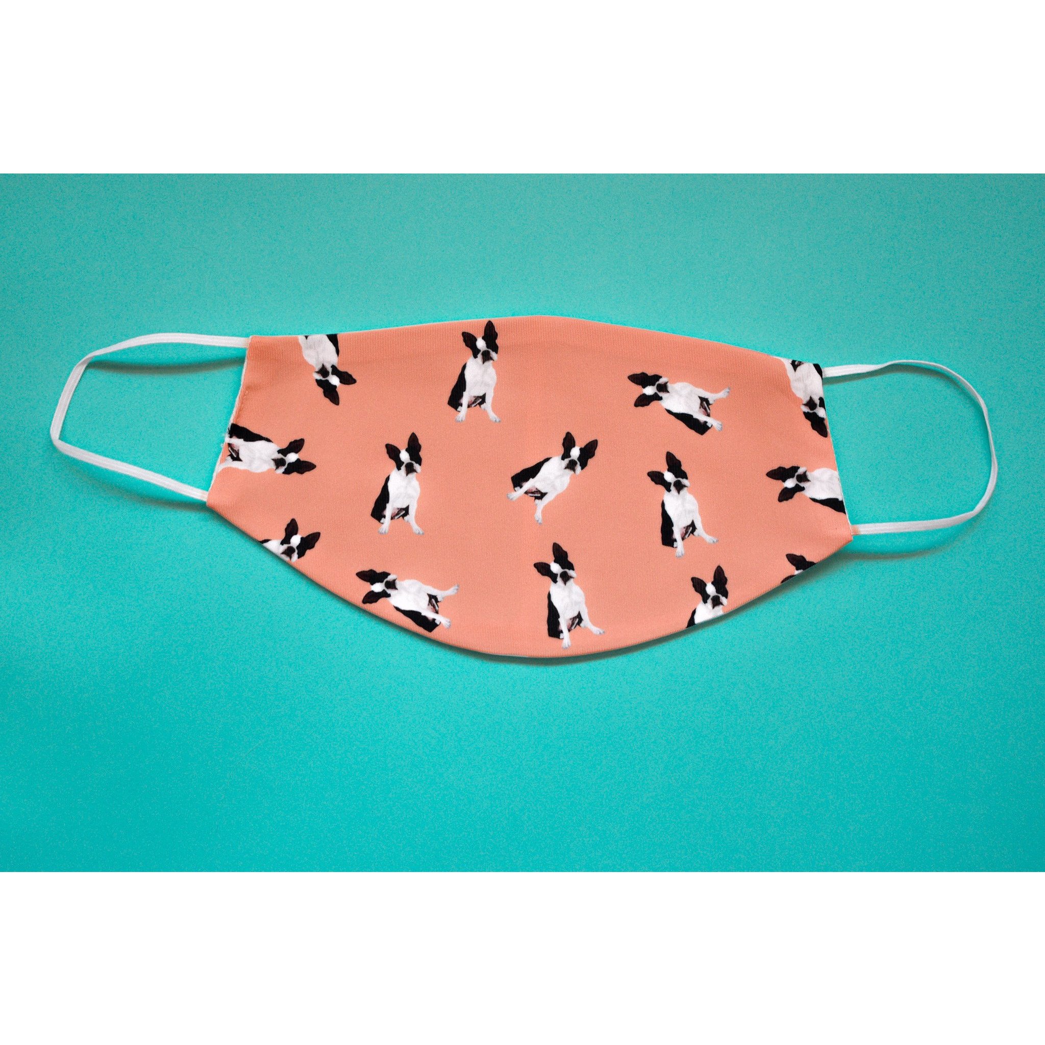 A handmade Boston Terrier face cover featuring a cute design, made from breathable polyester and organic cotton, perfect for everyday use.