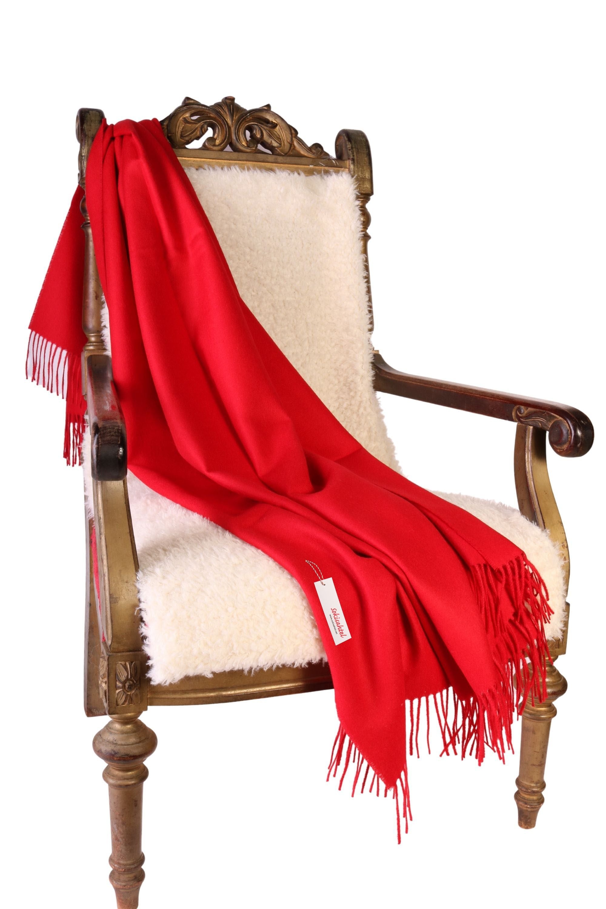Bright red alpaca wool plaid, soft and luxurious, perfect for winter warmth and style.