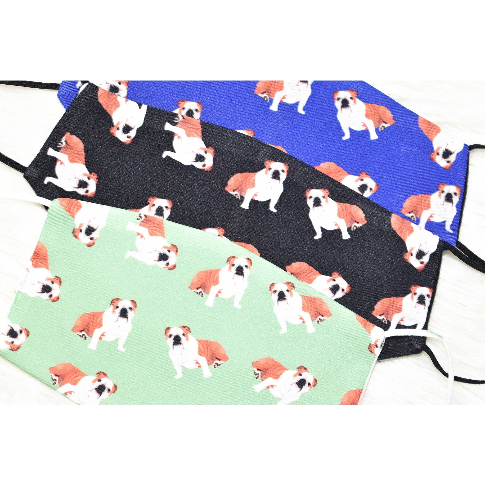 A stylish Bulldog Face Cover made from breathable polyester and organic cotton, featuring a metal nose clip and ear saver for comfort.