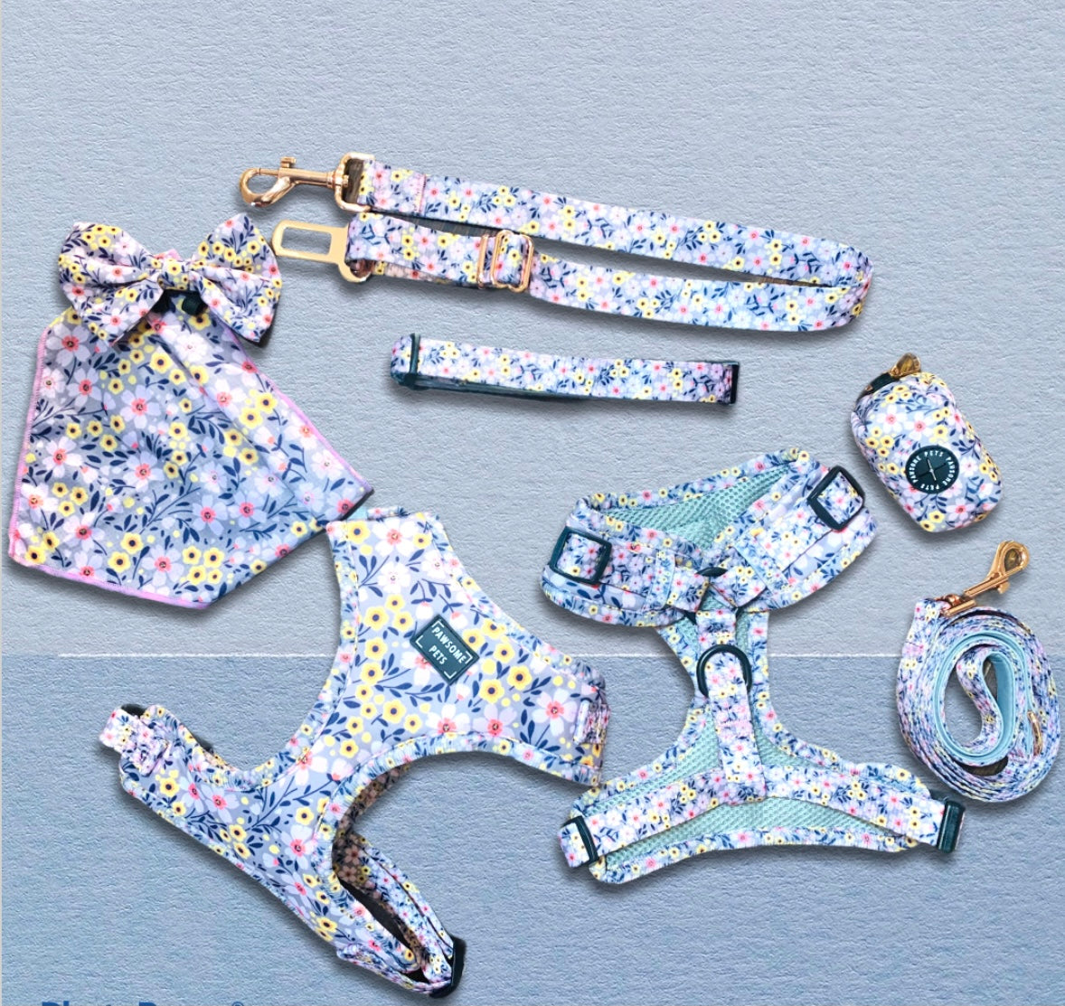 A colorful pet accessory bundle featuring an adjustable harness, leash, collar, waste bag holder, bowtie, and bandana, all designed for comfort and style.