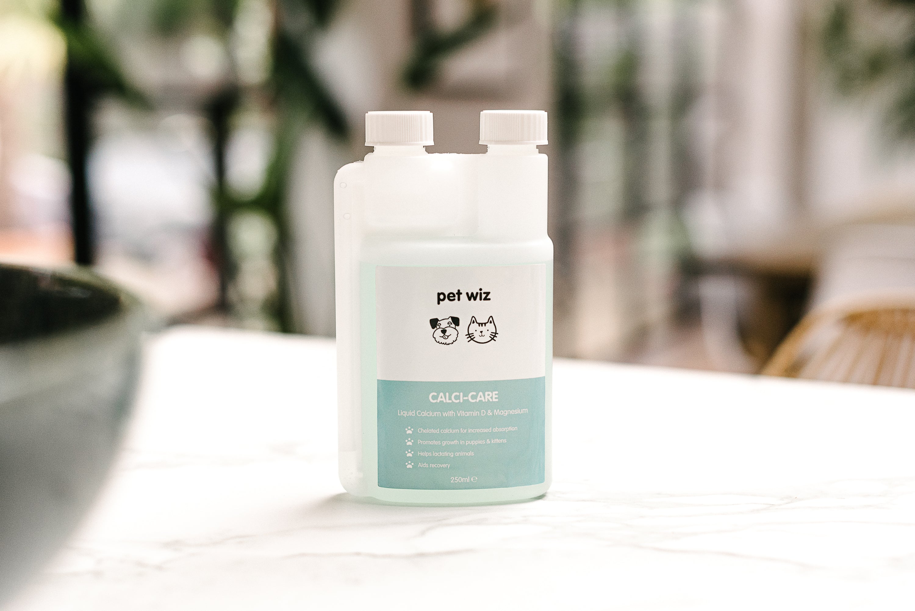 Bottle of Calci-Care liquid calcium supplement with Vitamin D and Magnesium for pets, featuring a label highlighting its benefits for strong bones.