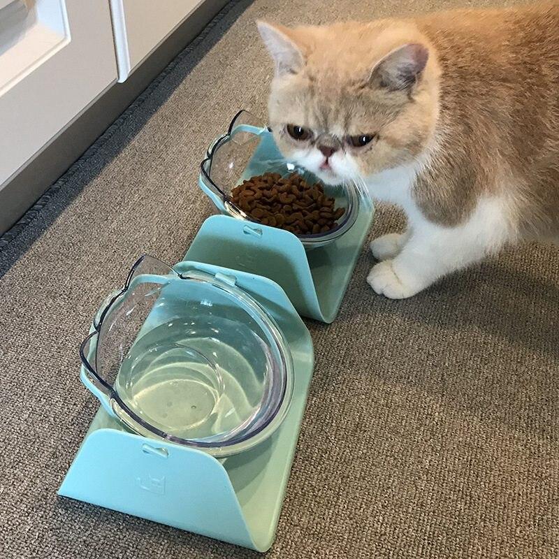 Cat feeding bowl set with raised stand, featuring double bowls for food and water, designed for comfort and convenience.