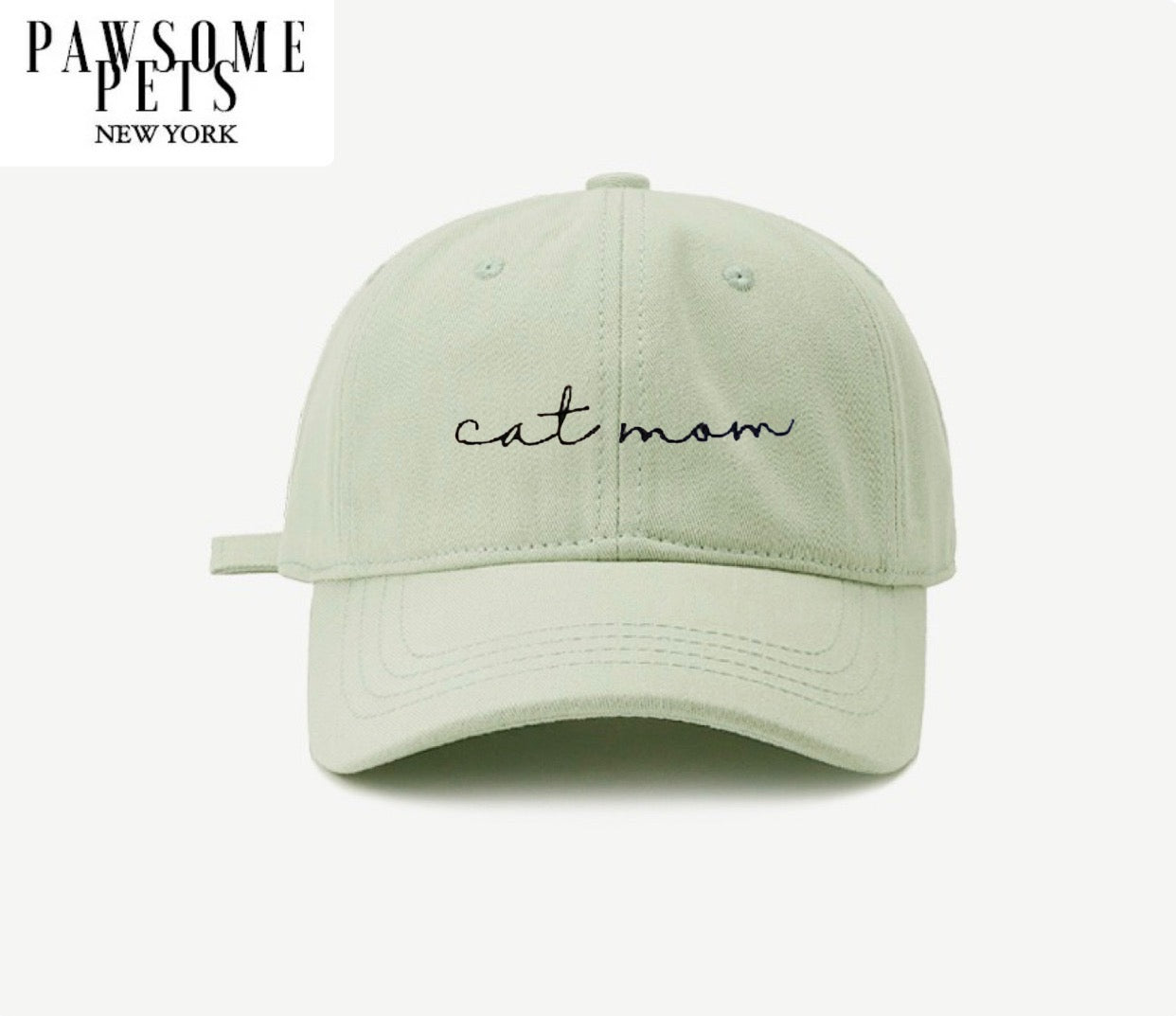 Light green CAT MOM baseball cap with embroidered lettering, adjustable metal buckle, and pre-curved visor, perfect for cat lovers.