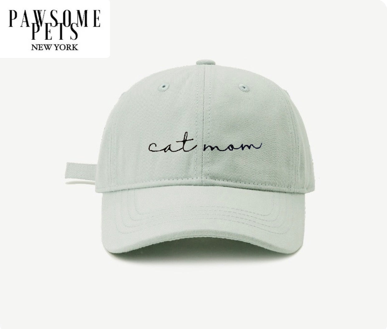 Mint green CAT MOM hat with embroidered lettering, adjustable buckle, and pre-curved visor.