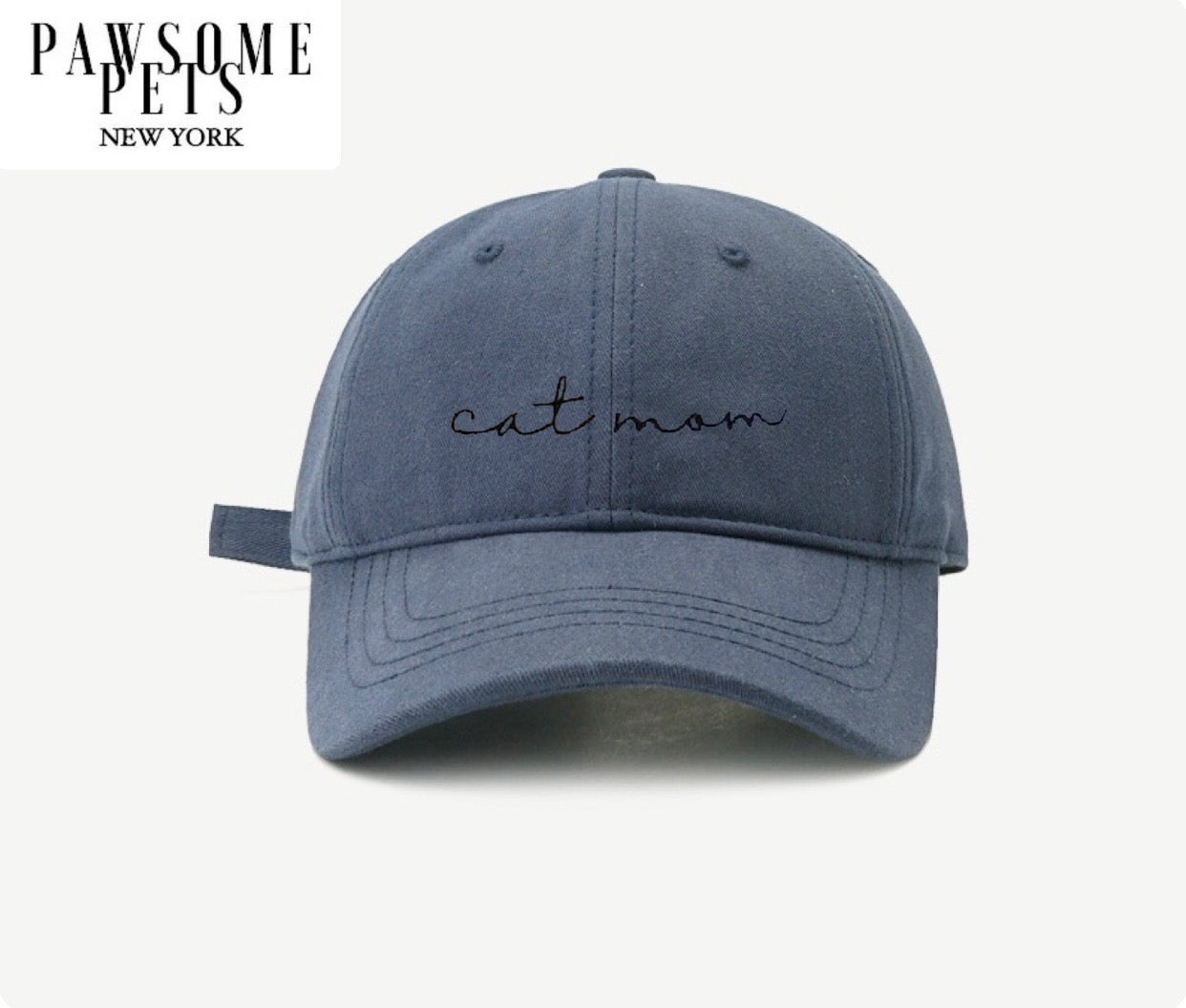 Navy blue baseball cap with embroidered CAT MOM lettering, showcasing a stylish and comfortable design for cat lovers.