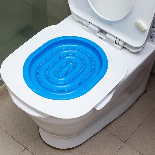 A Cat Toilet Training Kit featuring a training seat designed for easy installation on toilet rims, promoting mess-free cat toilet training.