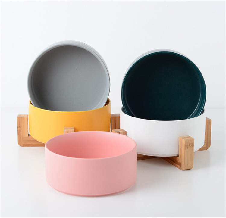 Ceramic bowl with bamboo stand designed for dogs and cats, featuring a stylish and stable design in vibrant colors.