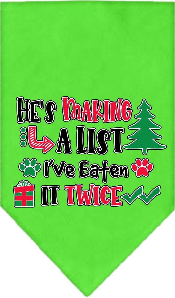 A festive Christmas dog bandana featuring the phrase 'He's Making A List, I've Eaten It Twice', designed for tie-on use with no buckles.