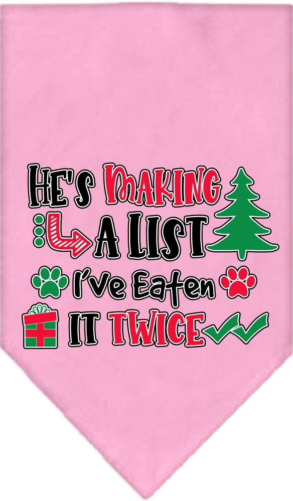 A festive Christmas dog bandana featuring the phrase 'He's Making A List, I've Eaten It Twice', designed for tie-on use with no buckles.