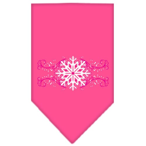 A pink dog bandana with snowflake swirls design, perfect for Christmas celebrations, tied around a dog's neck.