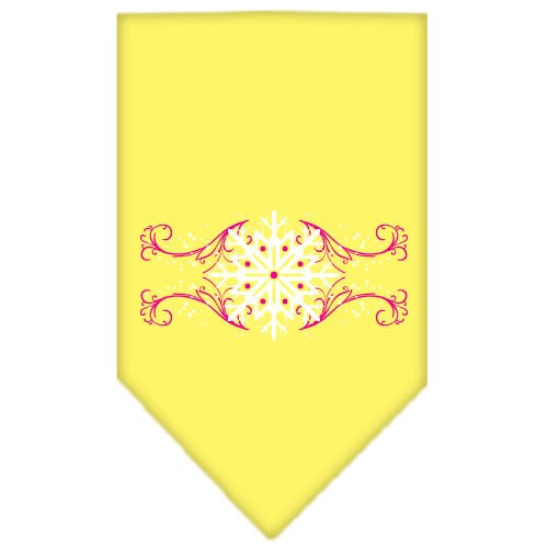 A pink dog bandana with snowflake swirls design, perfect for Christmas celebrations, tied around a dog's neck.