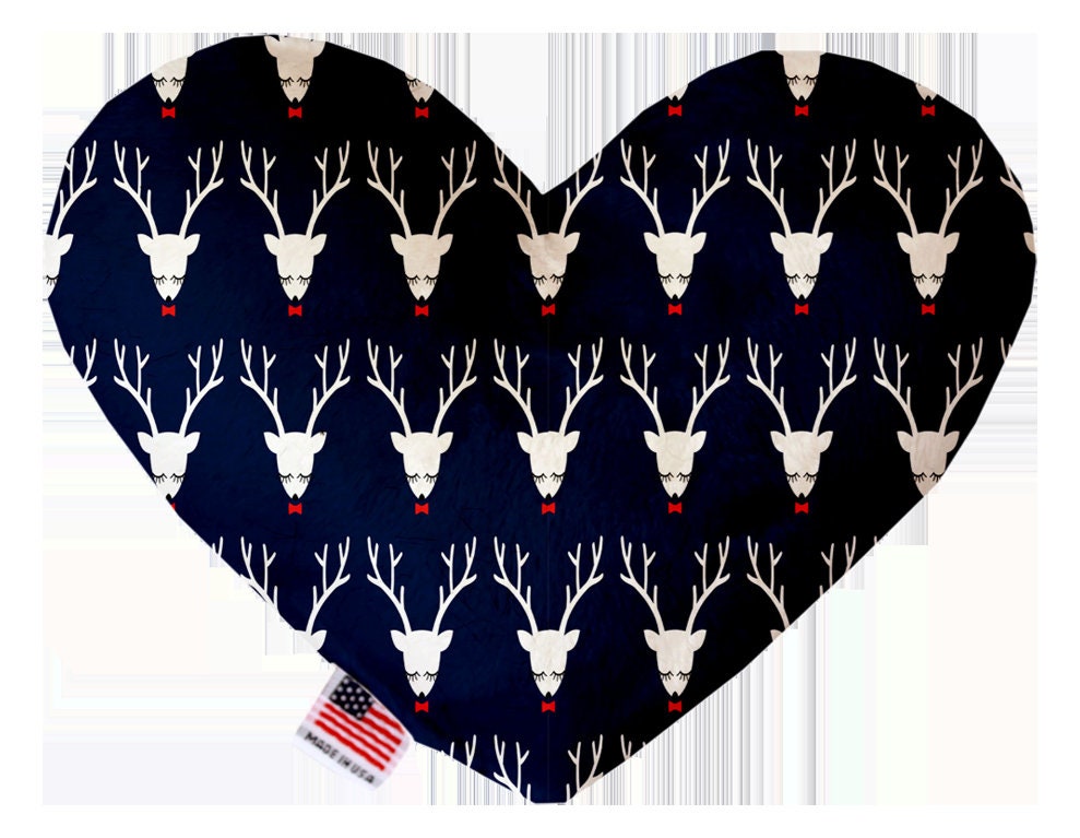 A plush heart and bone toy for pets, featuring festive Christmas patterns, soft texture, and squeakers, perfect for dogs and cats.